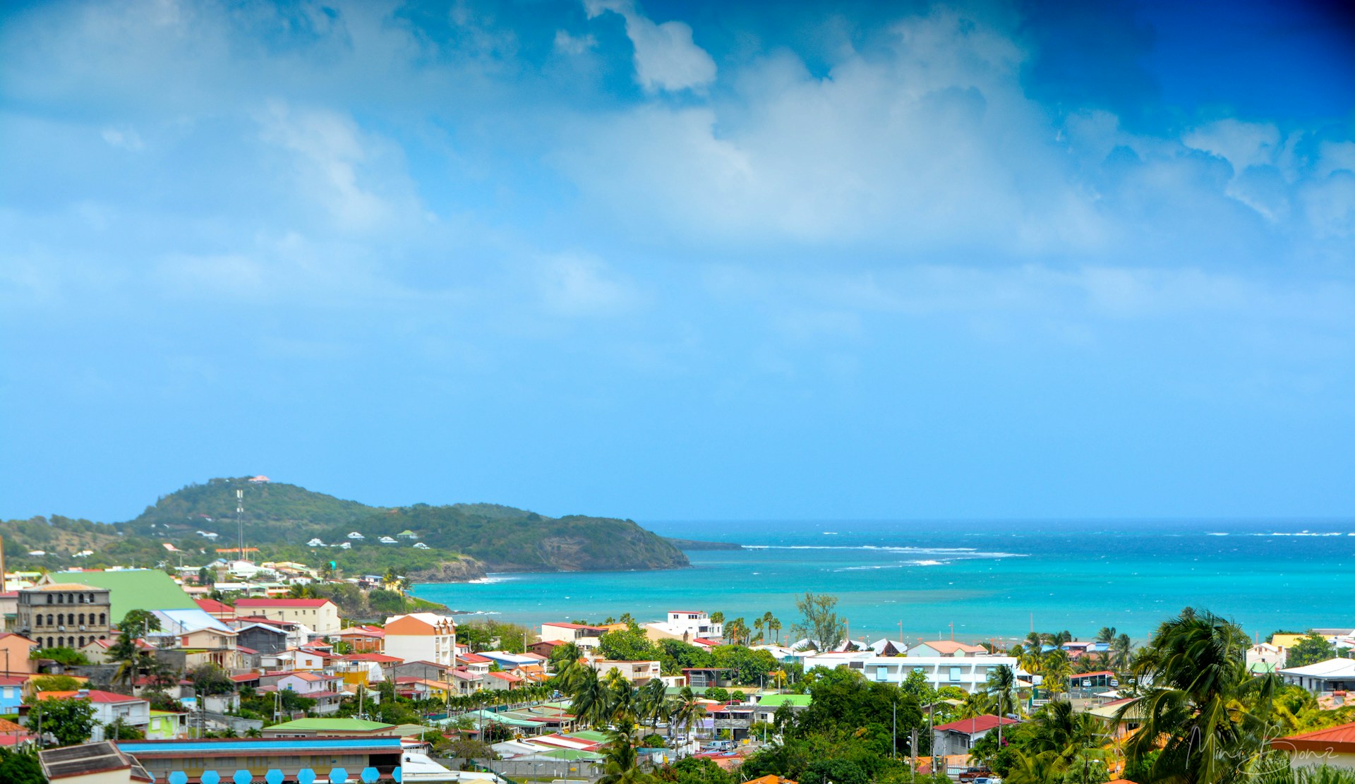 Caribbean coastal town in Martinique with colorful buildings and ocean views