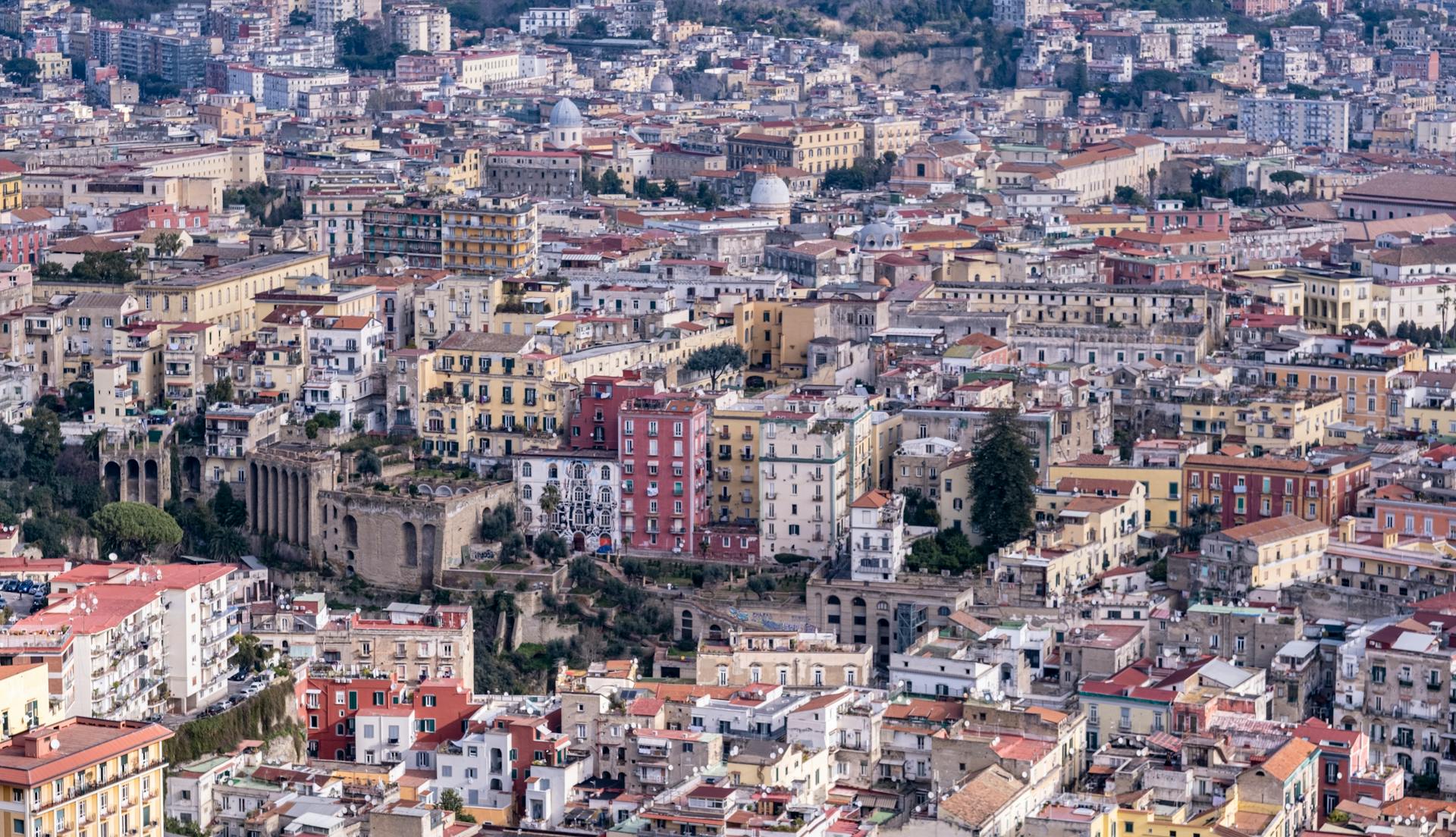 Cityscape of Naples Italy with dense buildings and historic architecture near the coast