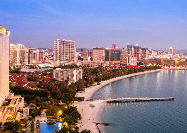 Sihanoukville Cambodia beachfront with hotels and city skyline at sunset