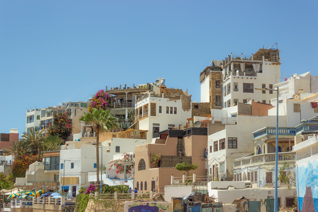 Coastal hillside homes and buildings in Agadir Morocco under clear blue sky