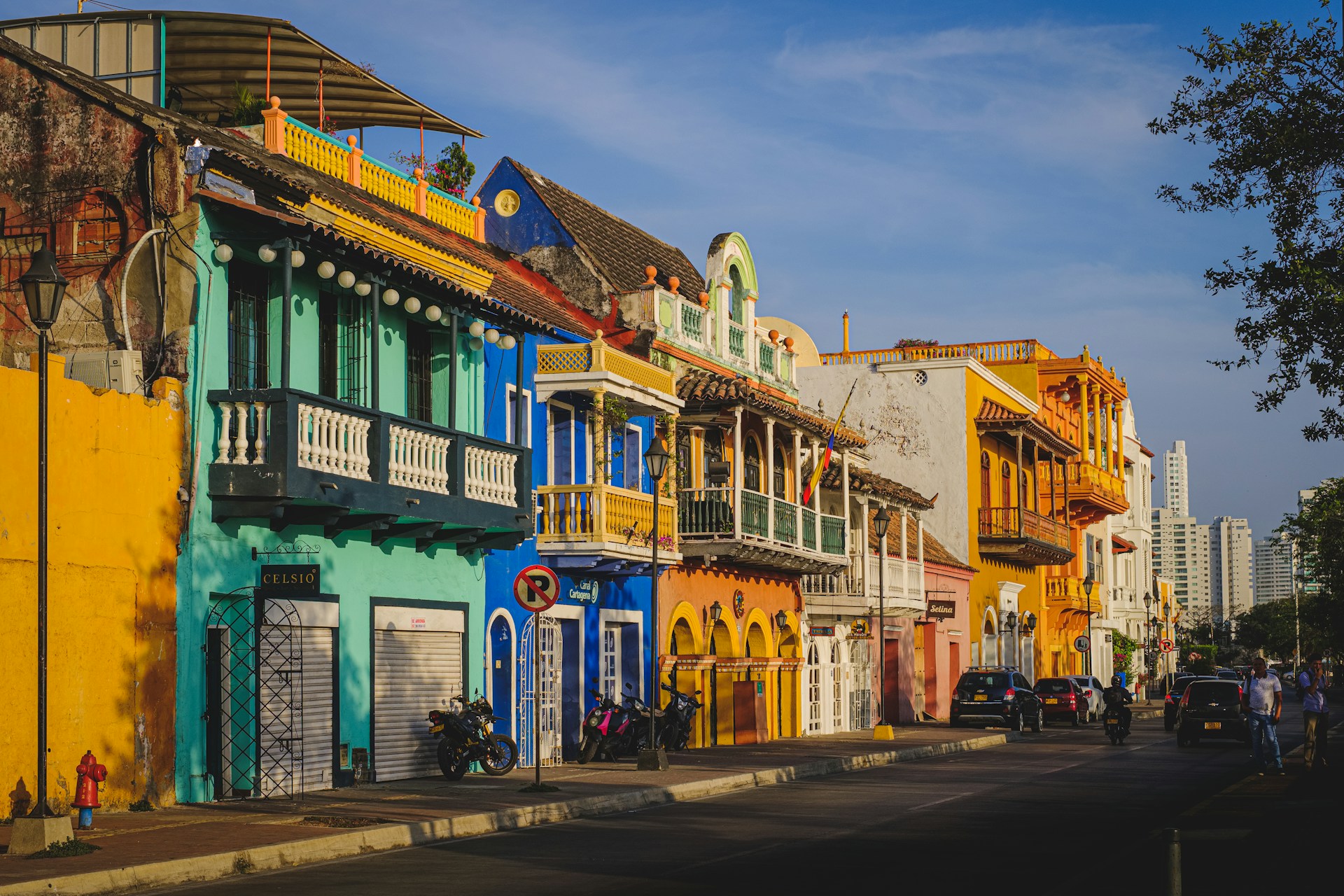 Colorful colonial street in Cartagena Colombia with bright buildings and balconies